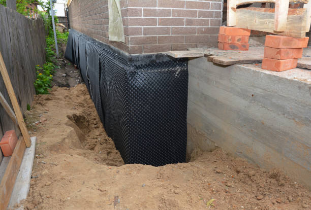 SJ Waterproofing Pros technician performing targeted Waterproofing assessment in Victor, NY